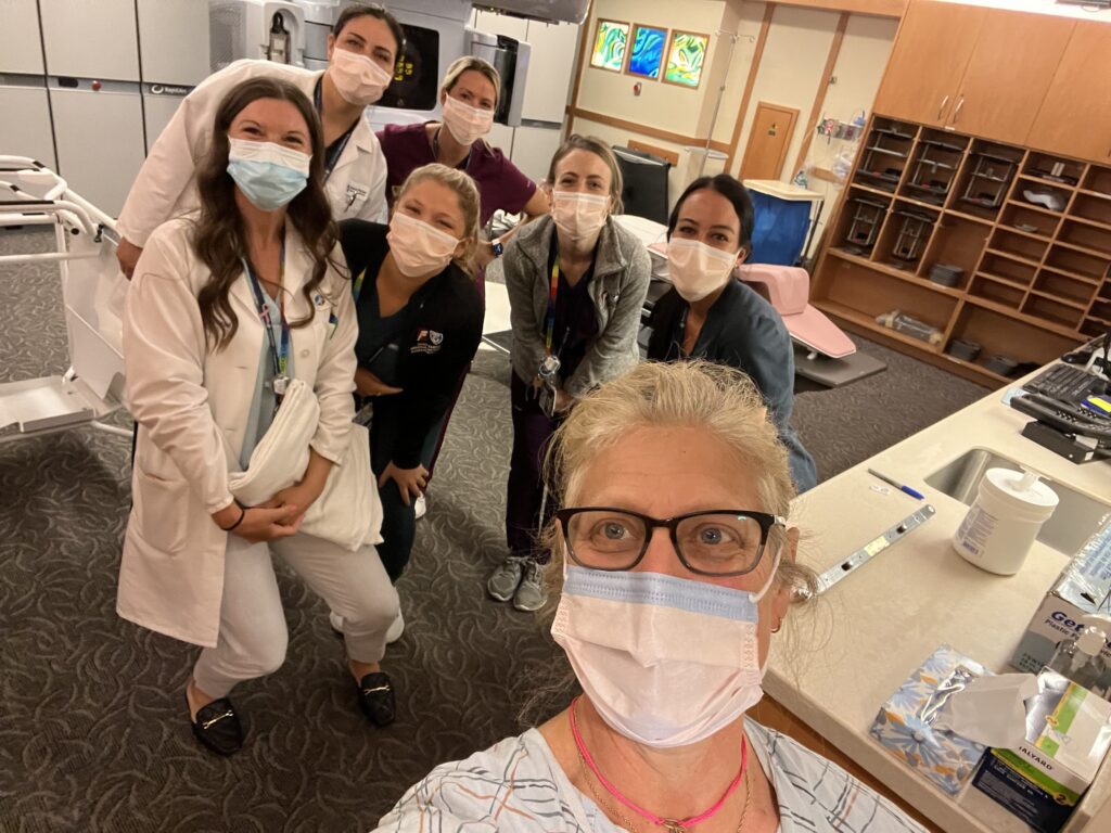Jennifer Brock takes a selfie with her radiation team.