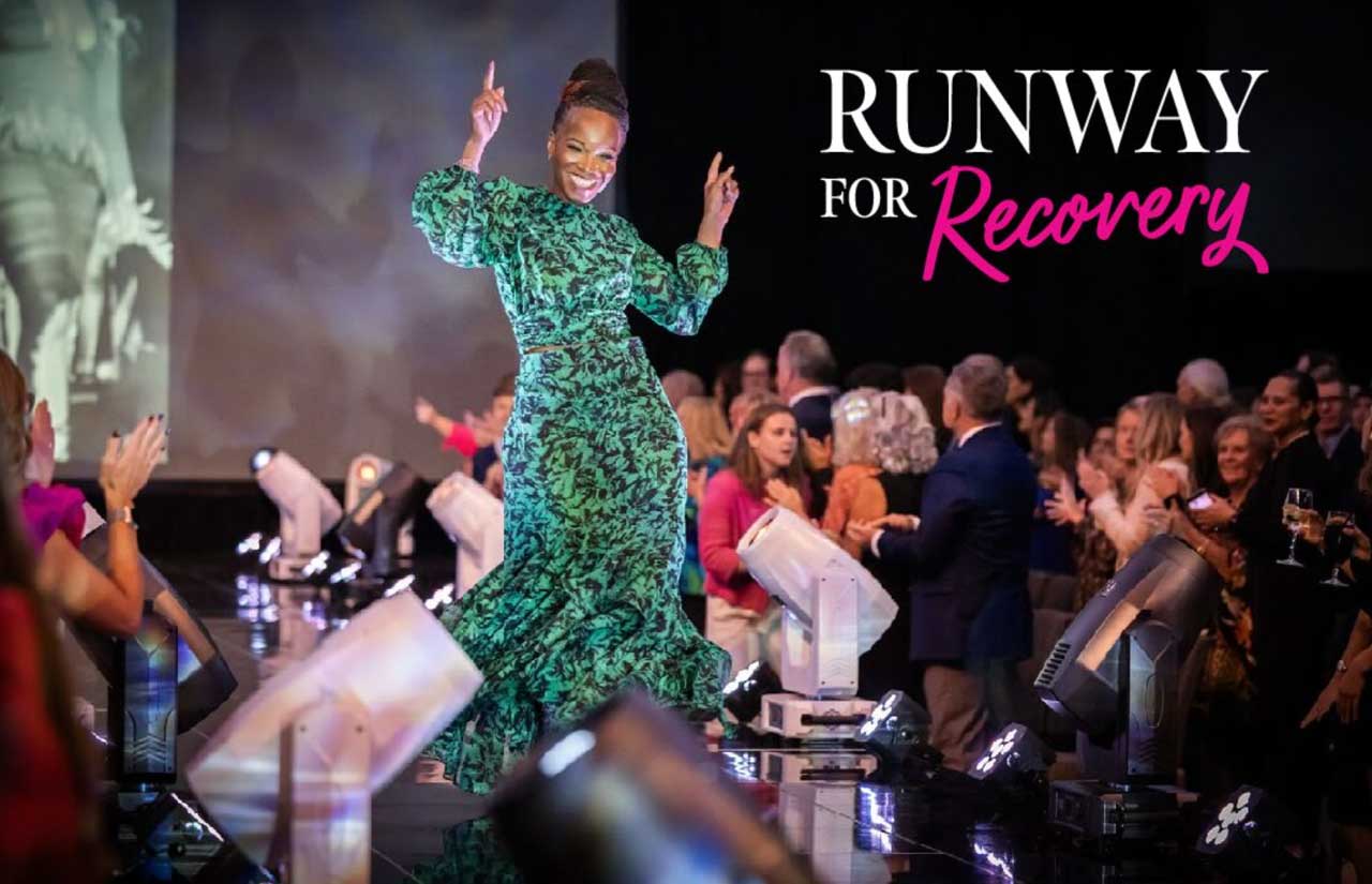 model in green gown modeling on Runway for Recovery catwalk