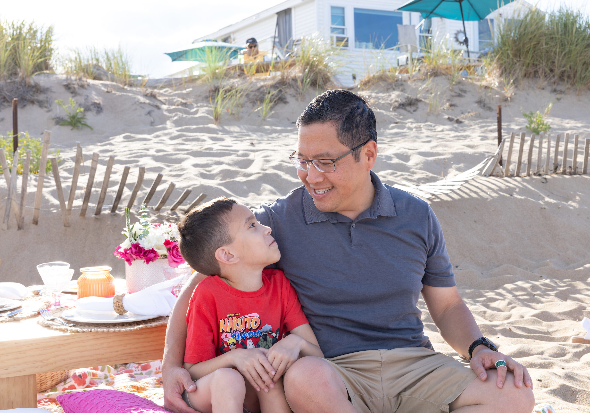 Image of a father and son from the funded families beach day photoshoot.