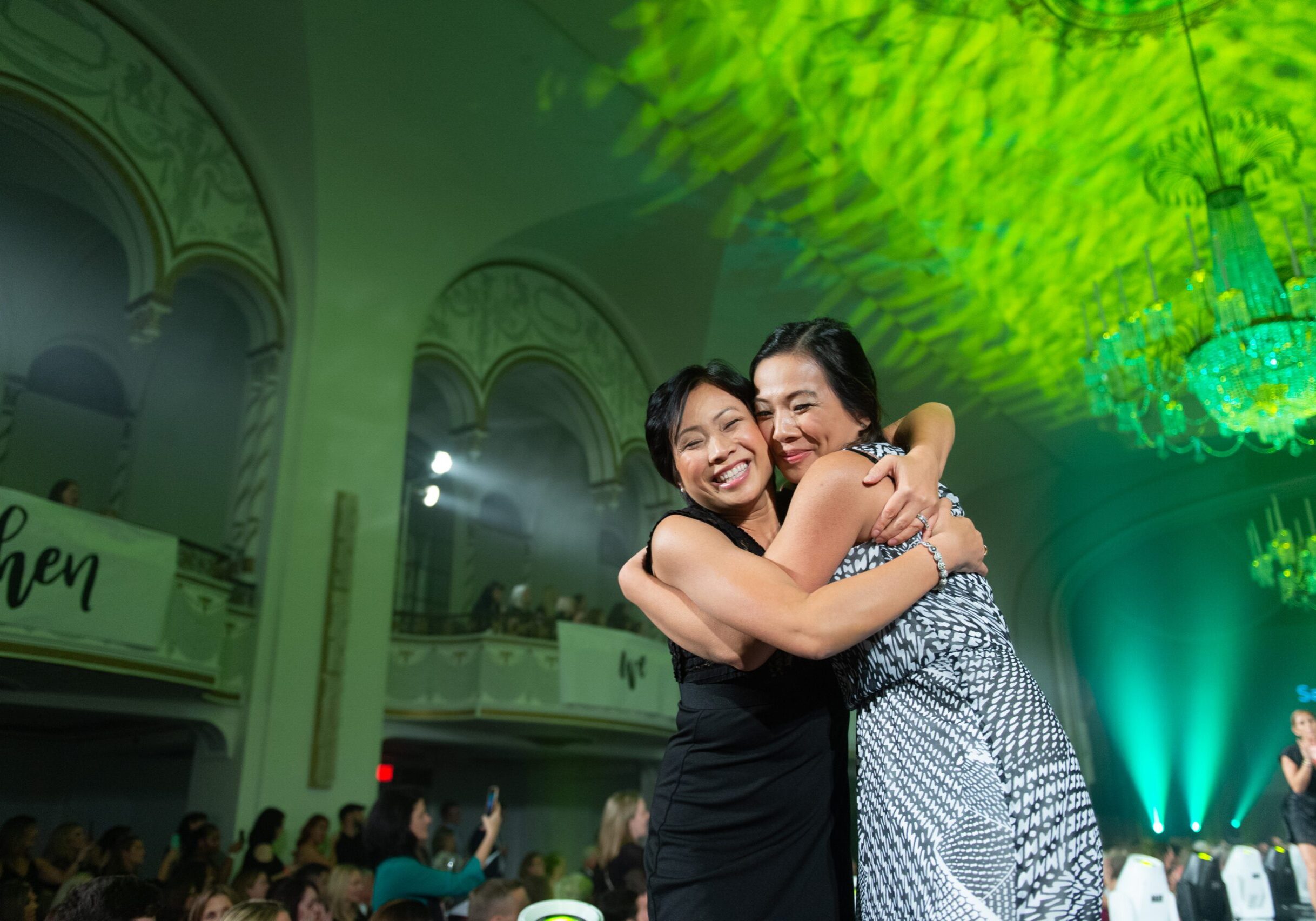 image of a mother and daughter hugging during the Runway Show